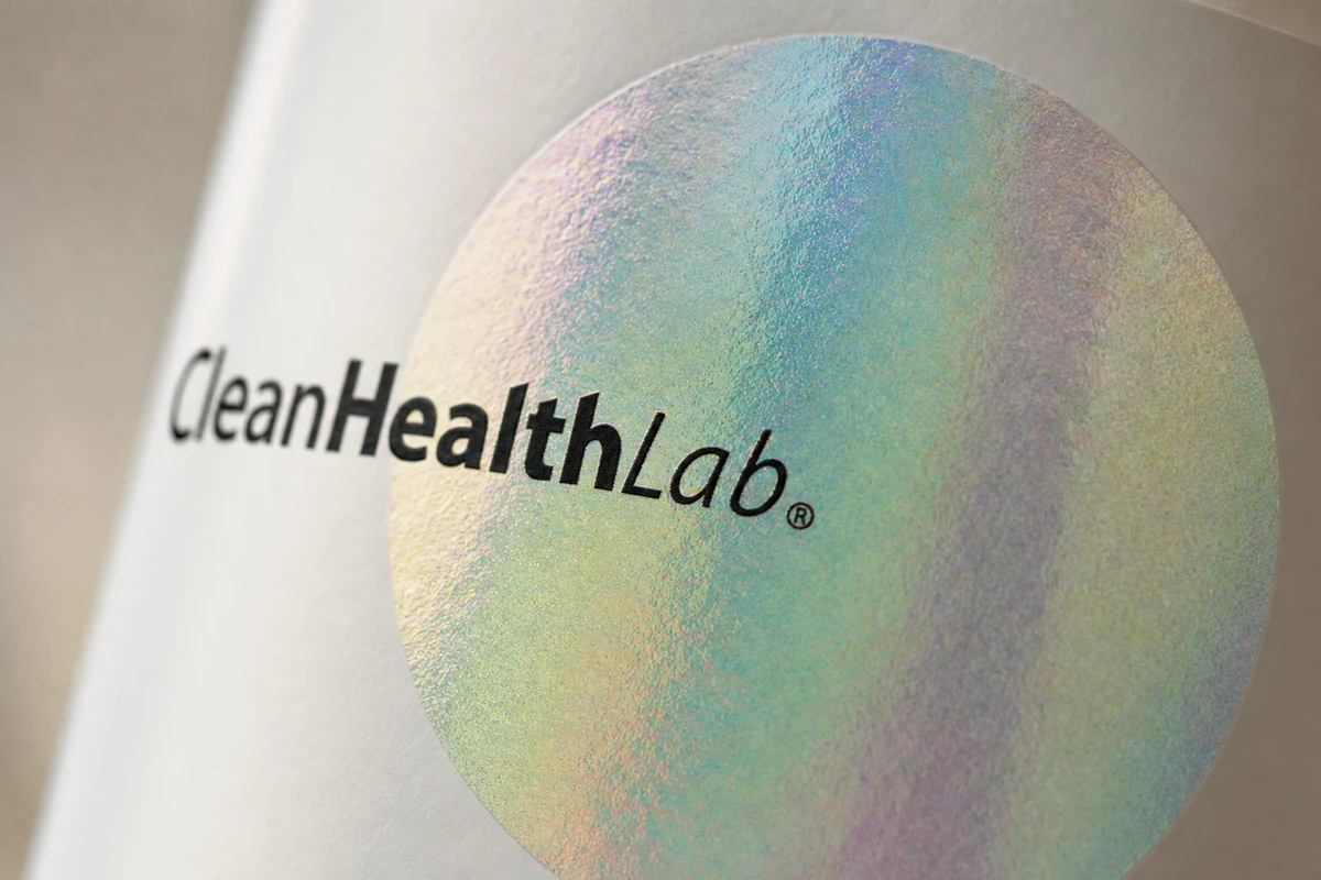 Macro detail of the iridescent holographic foil medallion