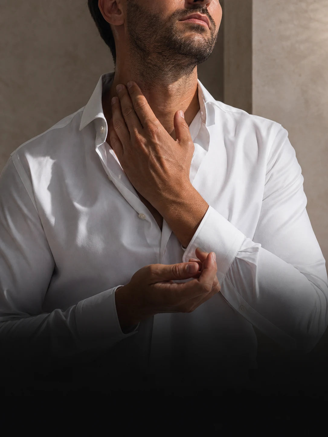 A man finishing his grooming ritual before walking out