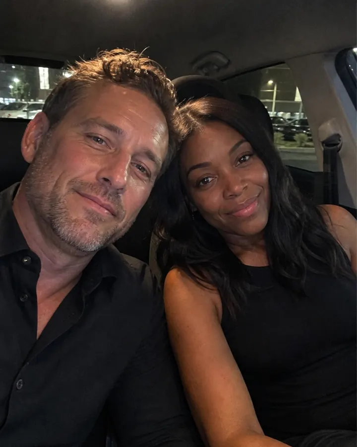 A couple taking an end-of-evening car selfie