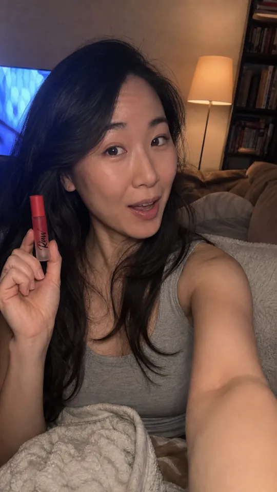 Woman on a couch describing her partner's cologne