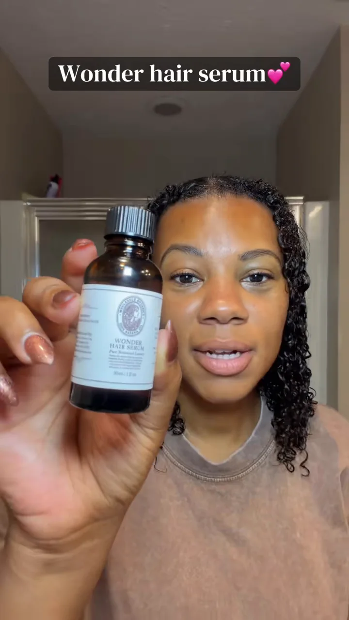 Denita with her curls in her original Wonder Hair Serum TikTok routine